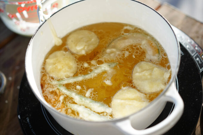 pot of vegetables frying in oil