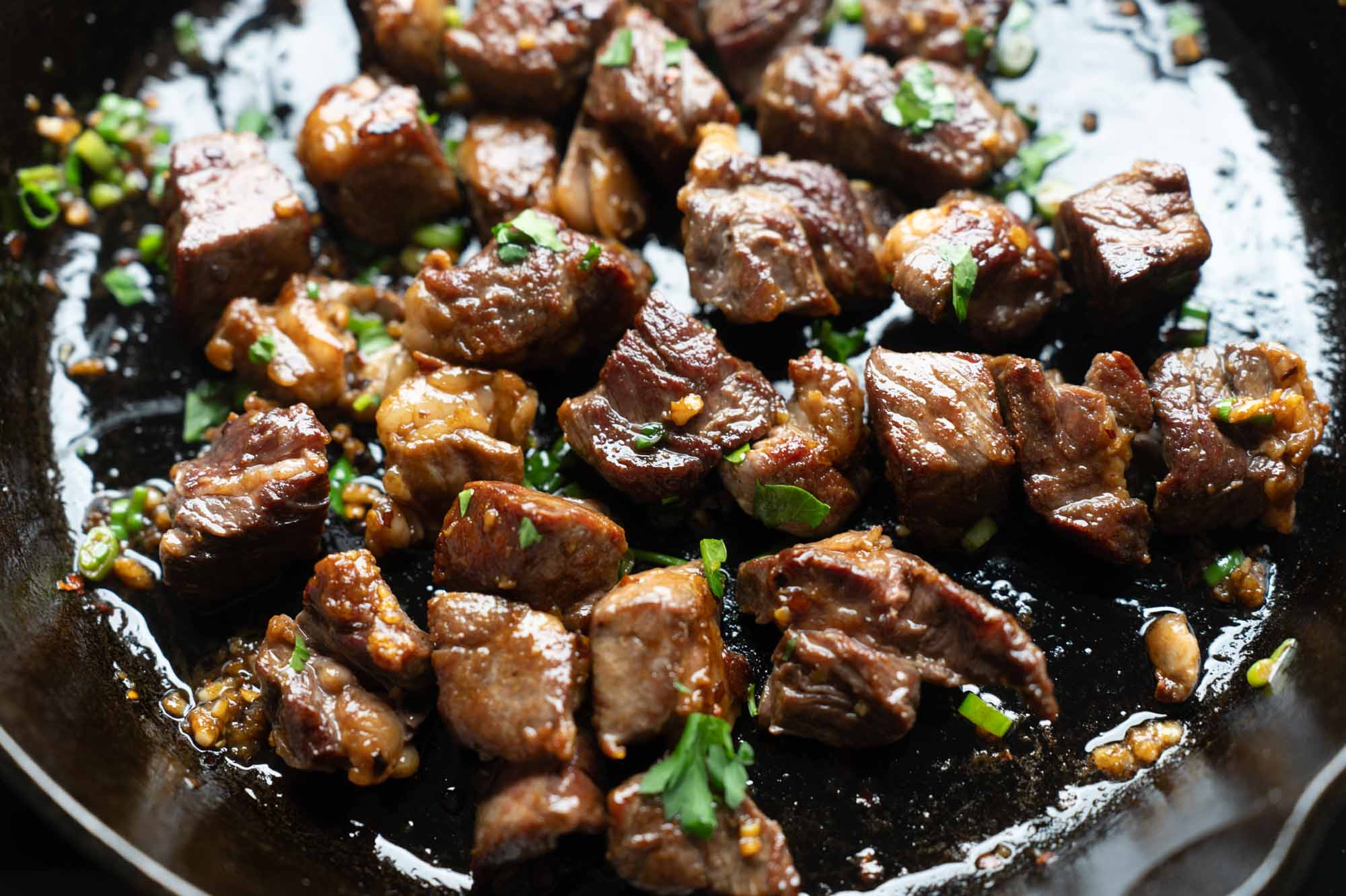 garlic butter steak bites w scallion and parsley