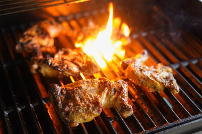 grilling chicken on a gas grill, with flare ups