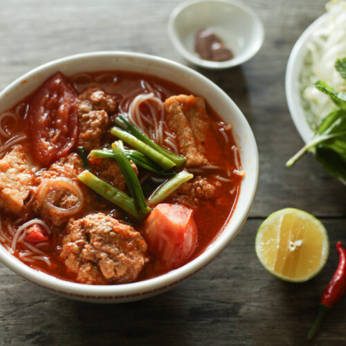 a bowl of bun rieu noodle soup