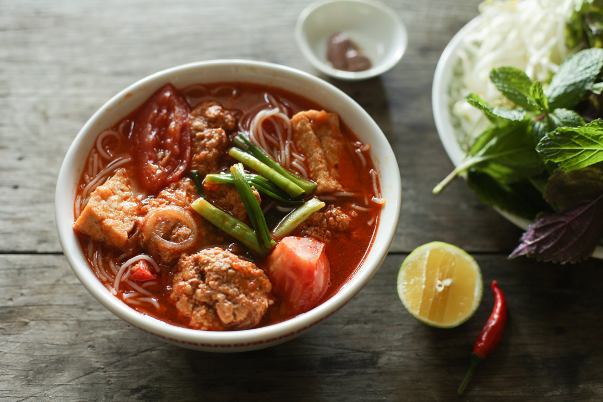 a bowl of bun rieu noodle soup