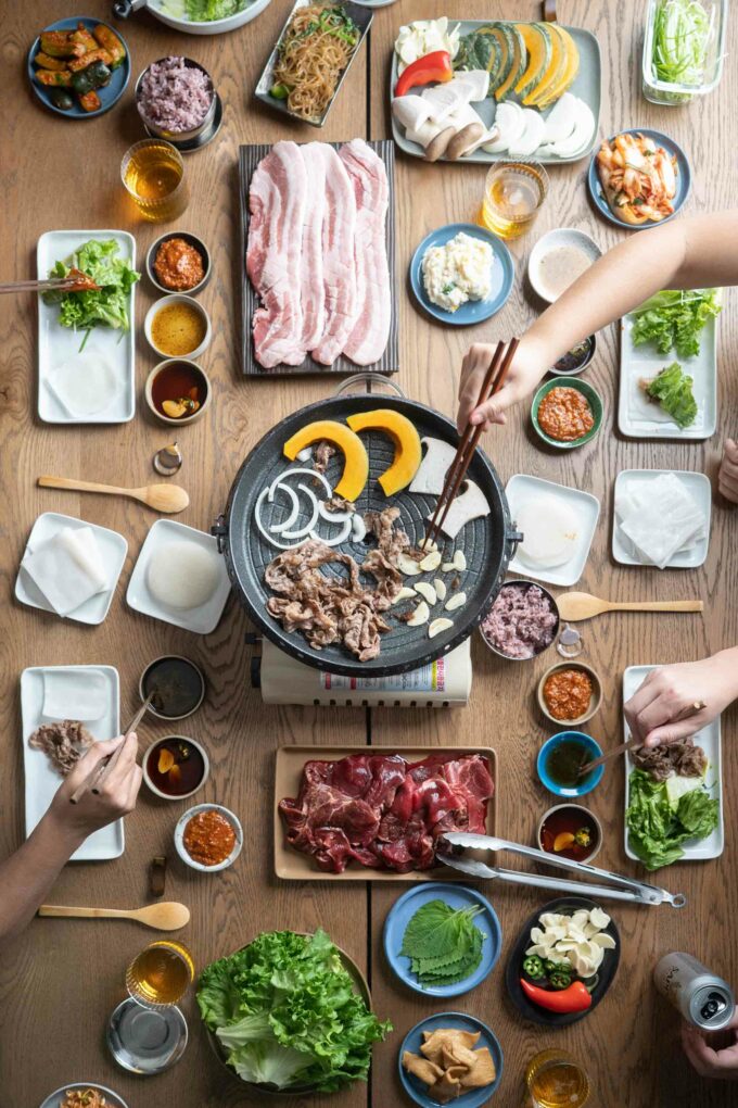 https://www.hungryhuy.com/wp-content/uploads/korean-bbq-table-spread-680x1020.jpg