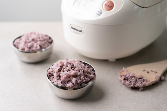 two metal bowls of Korean purple rice
