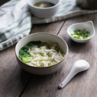bowl of wonton soup with bok choy