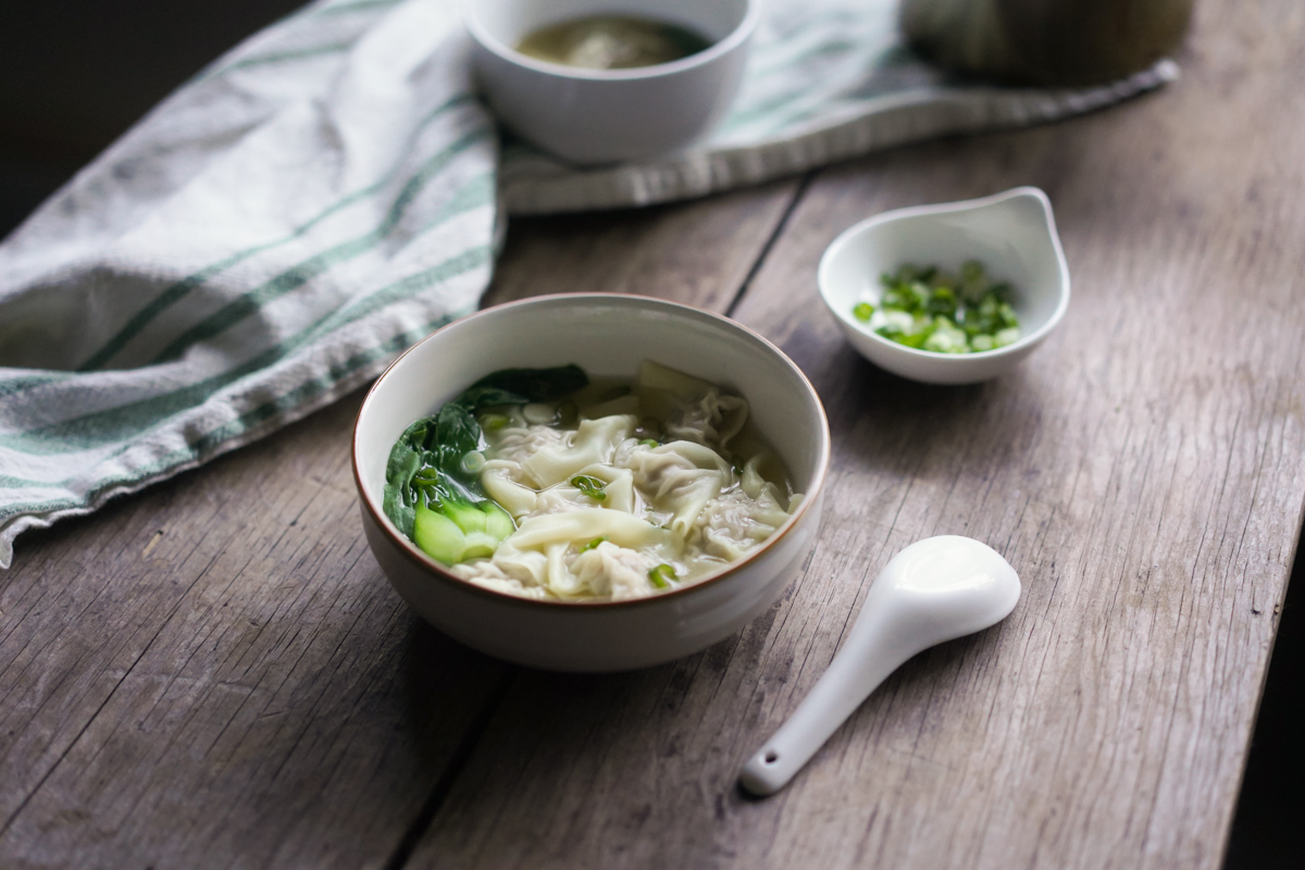 bowl of wonton soup with bok choy