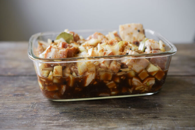 marinading pork adobo in glass container