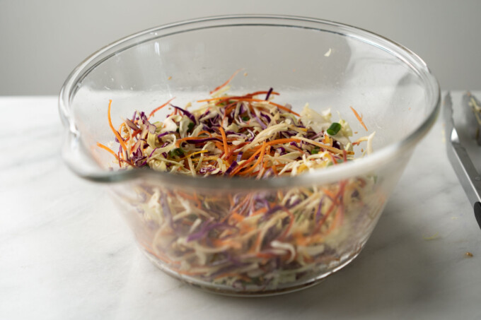 marinating coleslaw in a bowl