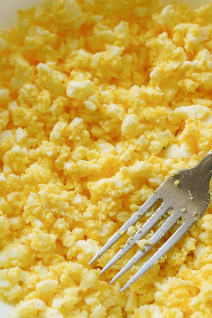 closeup texture of mashed hardboiled eggs