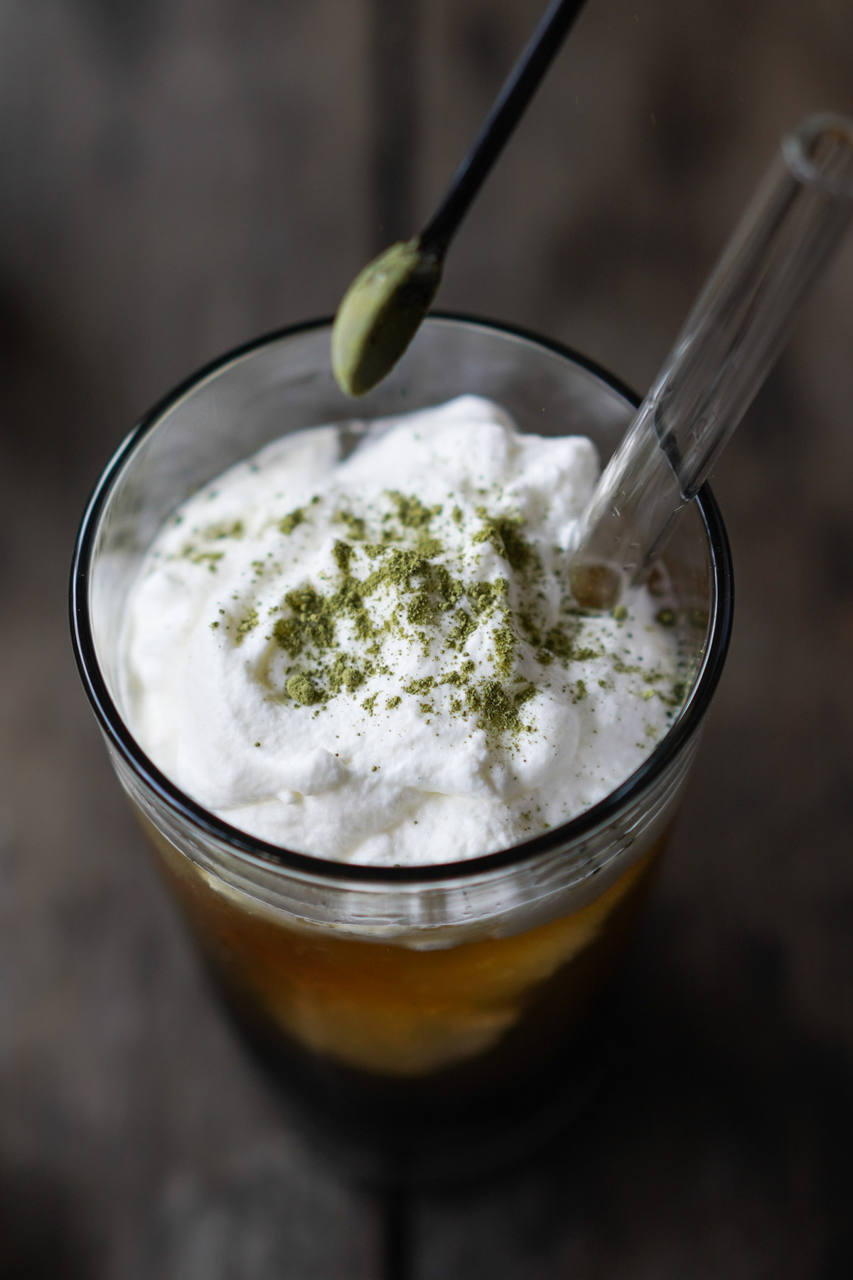 closeup of adding matcha tea powder