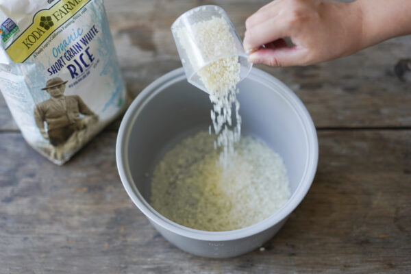 measuring uncooked rice for a rice cooker