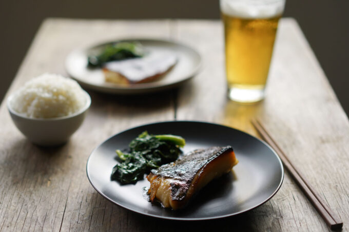 plates of miso-glazed black cod