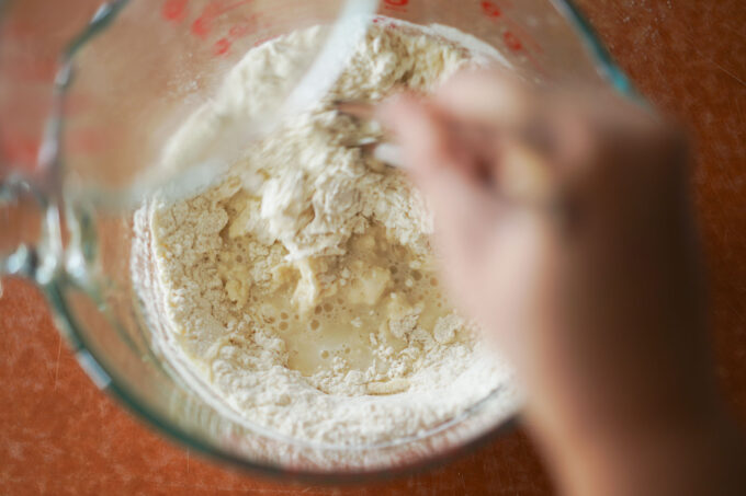 mixing flour and water with chopsticks