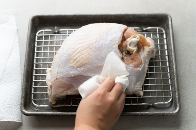 patting turkey breast dry with paper towel