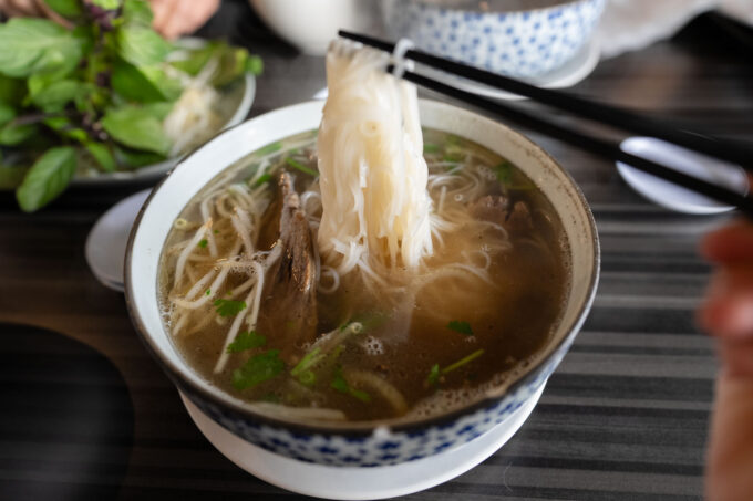 lifting rice noodles (pho noodles) at Pho Redbo