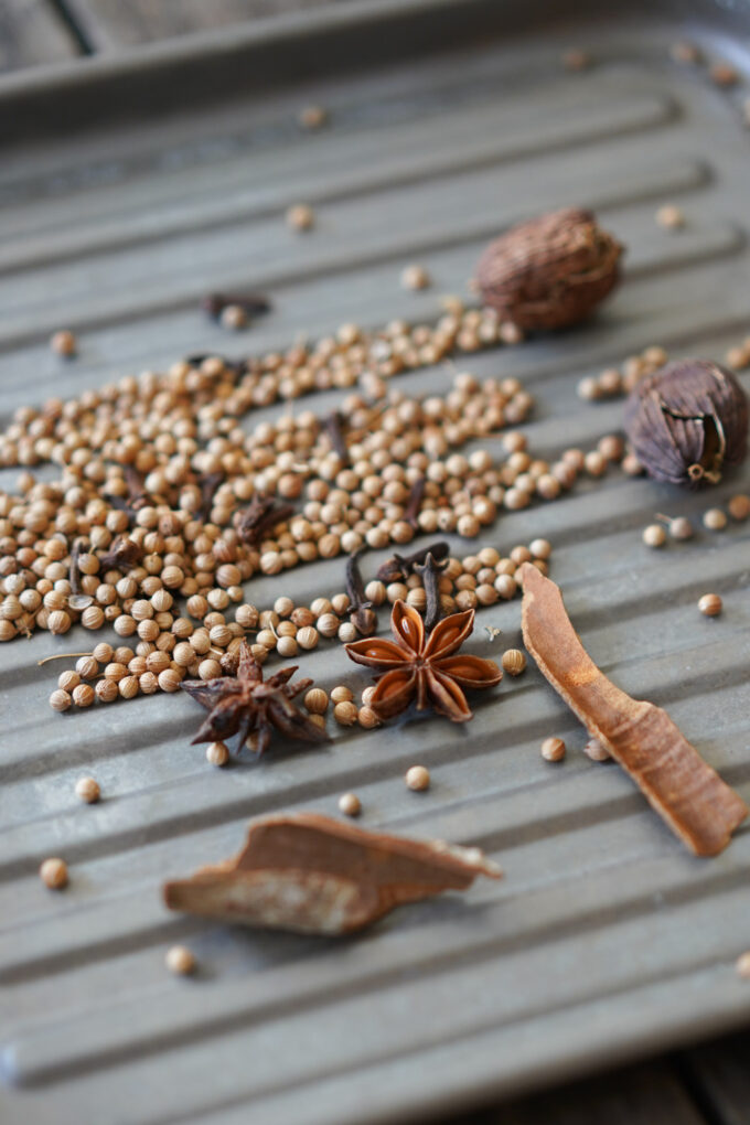 spices and aromatics for pho on a tray