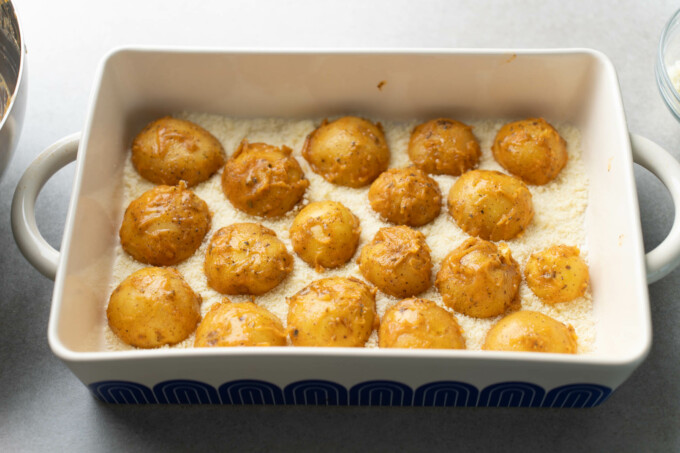potatoes face down in baking pan