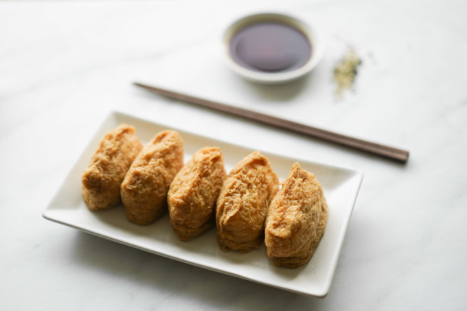 plate of plain inari sushi with soy sauce
