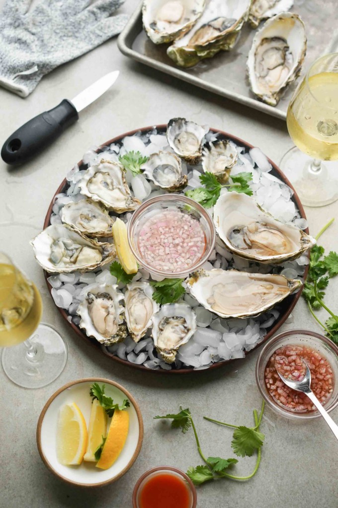 plated oysters on ice with mignonette