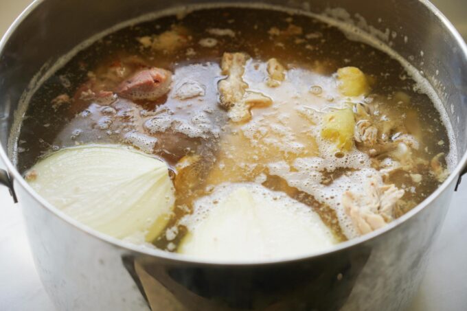 water, all aromatics and poultry added to the pot