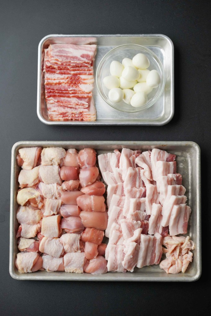 chicken, pork, and eggs cut for skewers