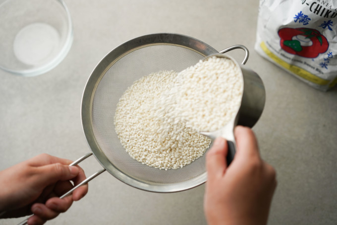 pouring rice into strainer