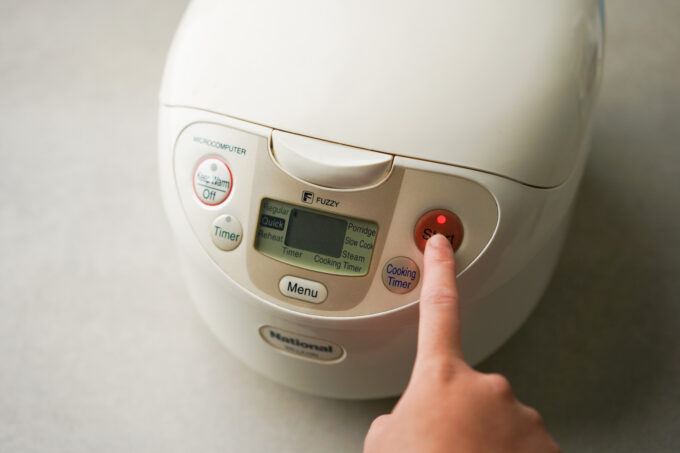 pressing start on rice cooker