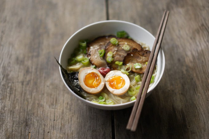 bowl of ramen with chashu and two ramen eggs