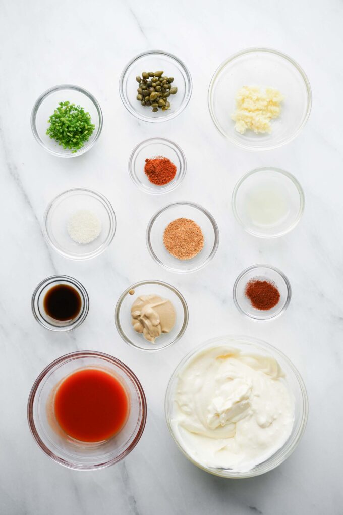 glass prep bowls with ingredients for crab cake sauce