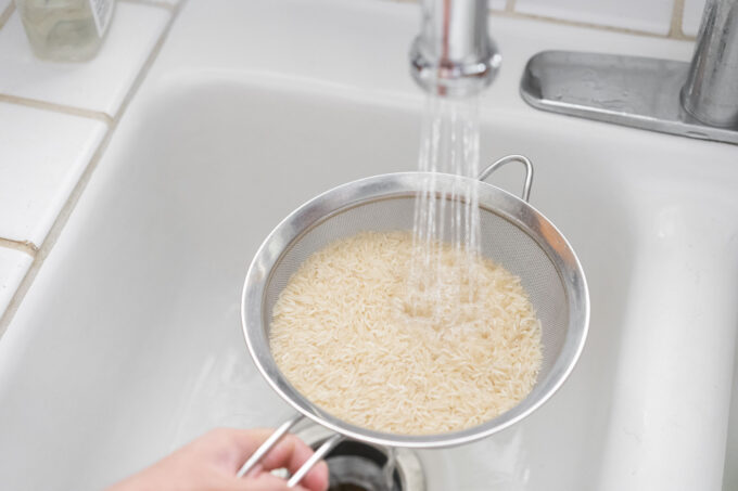 rinsing basmati rice in the sink