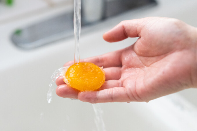 rinsing cured egg yolk under sink