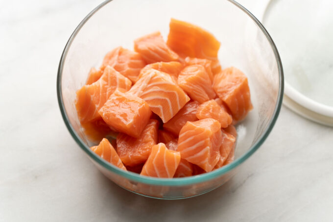 cubed salmon in glass container