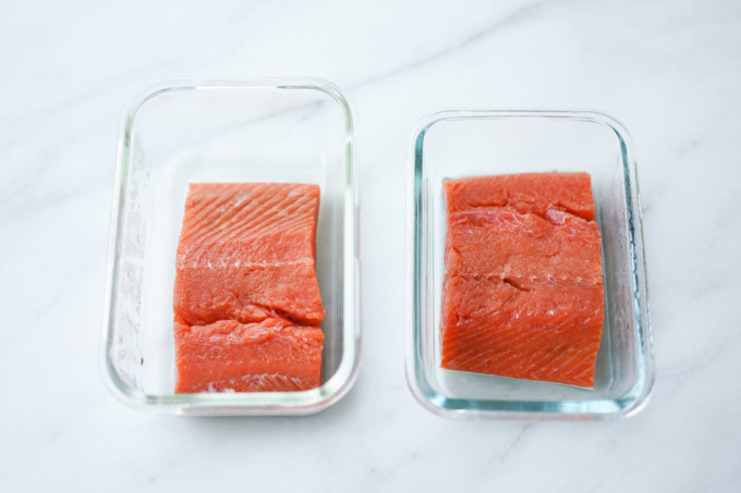 salmon filets in glass food containers