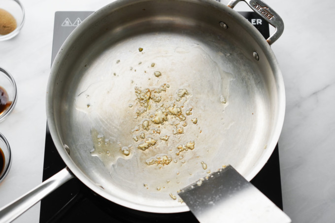 sauteing garlic in a pan