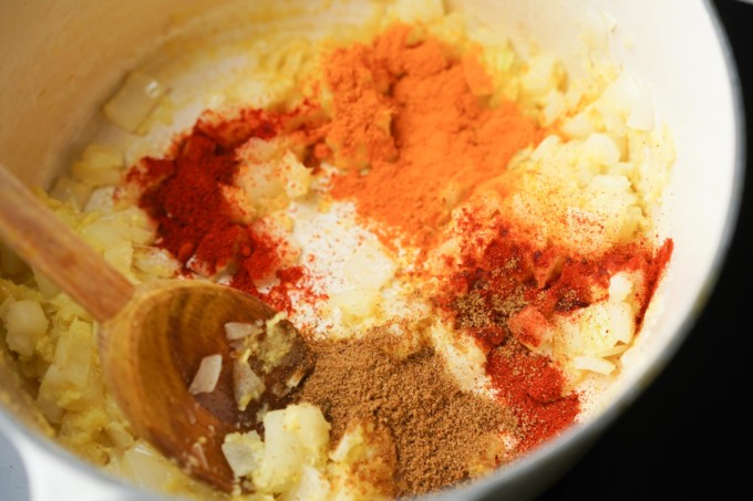 adding spices to the pot