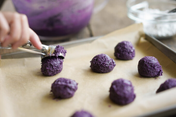 scooping out cookie batter with disher