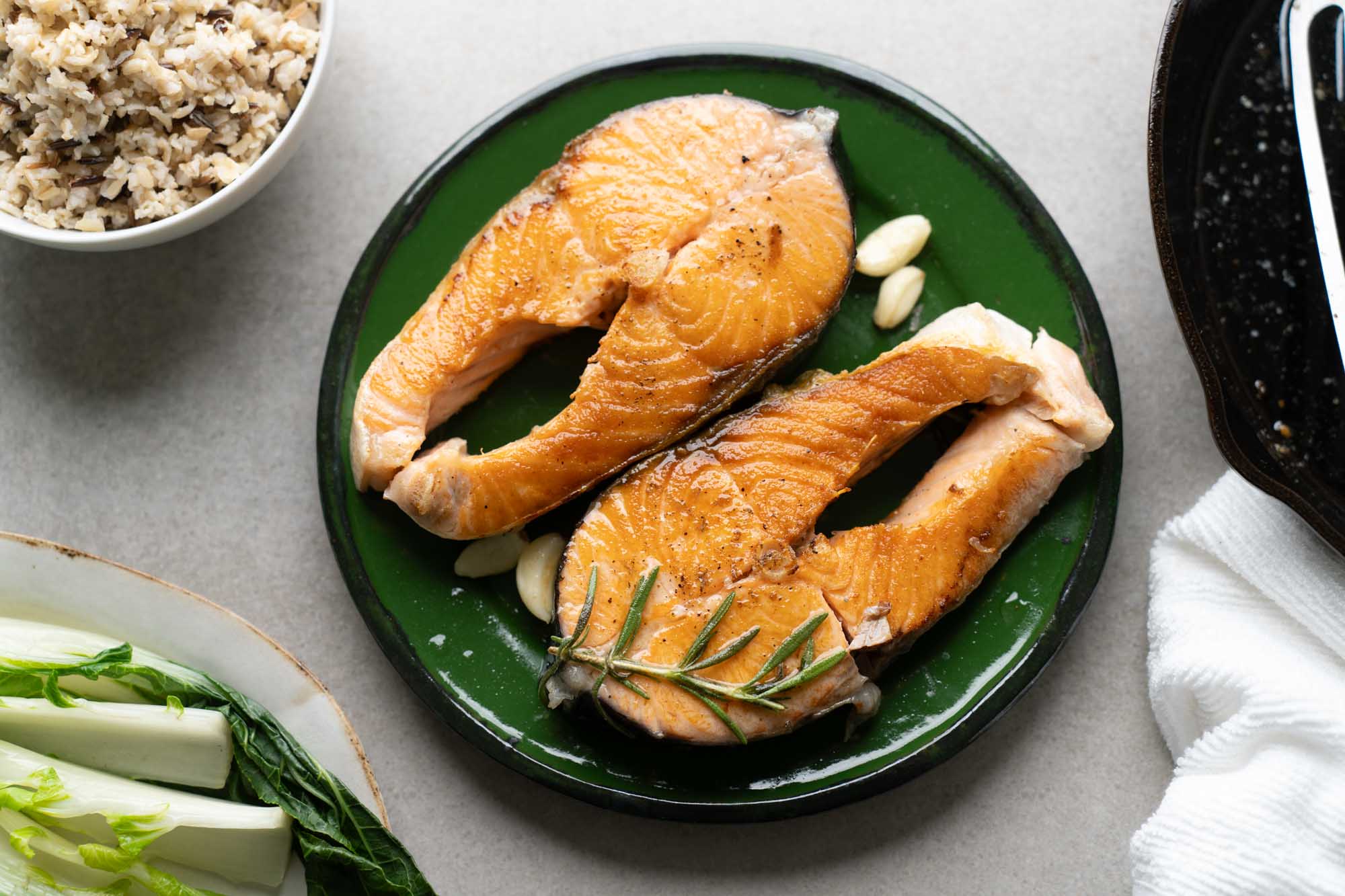 salmon steaks with veggie and rice sides