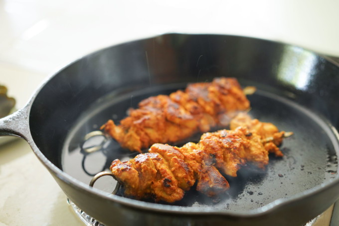 searing chicken skewers on cast iron