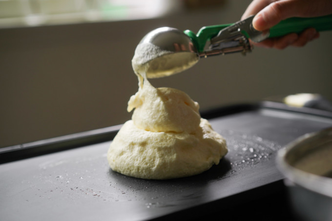 adding second scoop of batter onto pancake