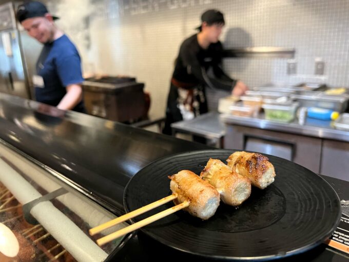 Shin Sen Gumi - bacon enoki skewer on counter