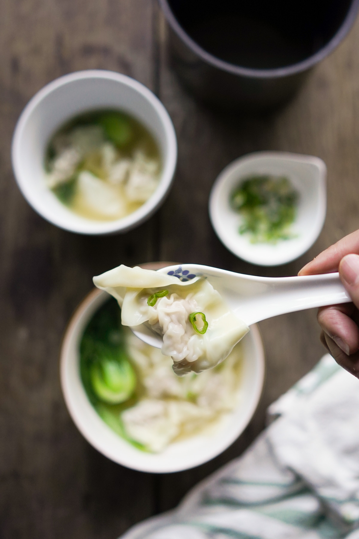 single wonton on a soup spoon