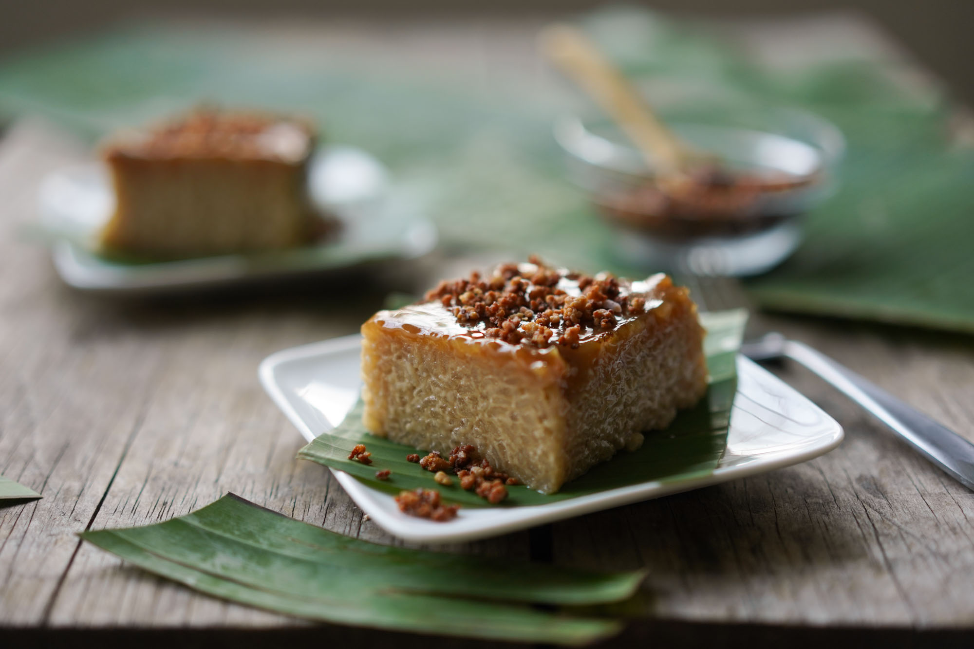 slice of biko on banana leaf and plate