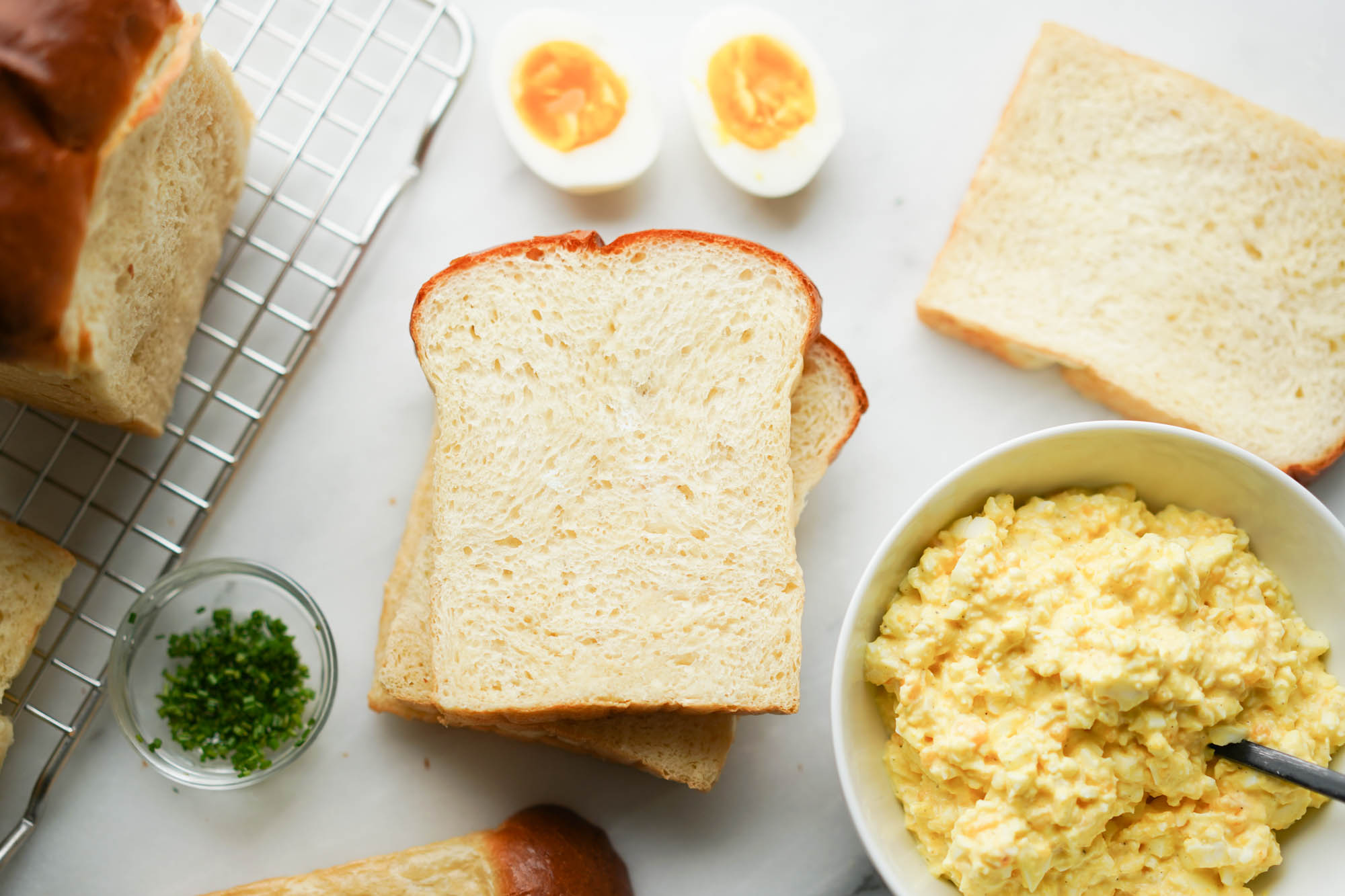 sliced shokupan bread with egg salad mixture