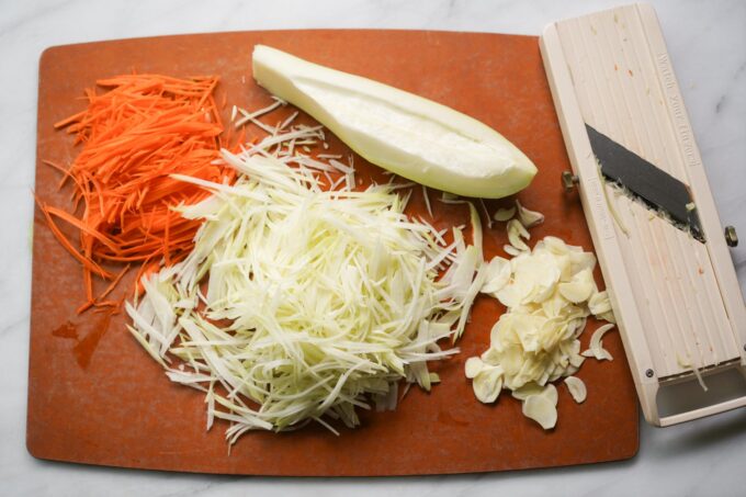 slicing papaya and veggies w a mandolin