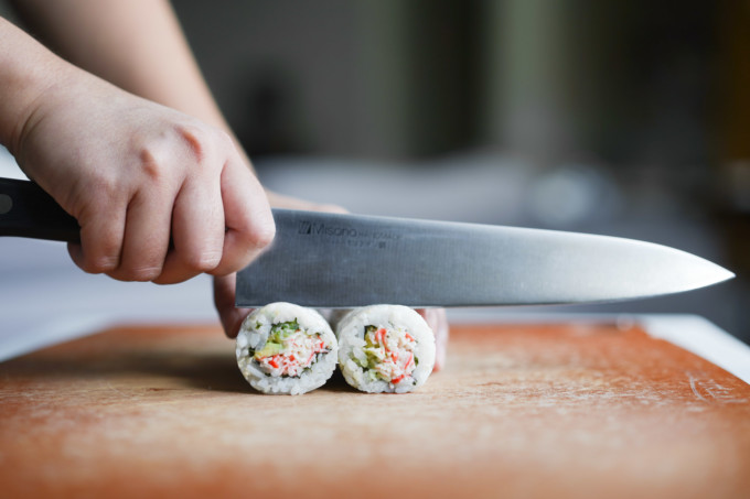 slicing california rolls with a knife