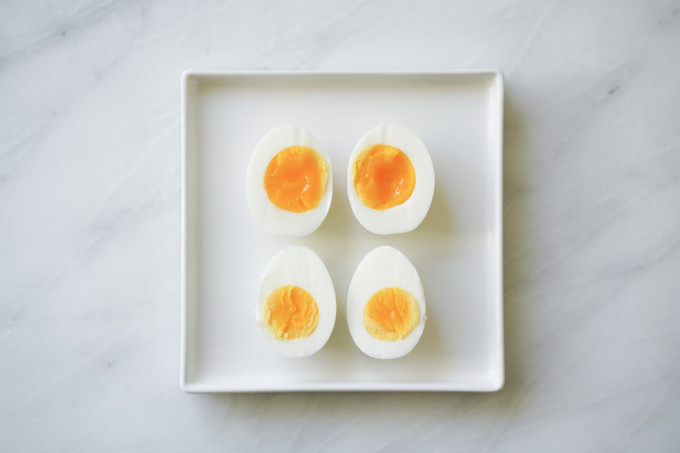 soft and hardboiled eggs cut in half