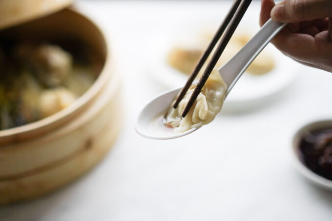 a pool of soup from xiao long bao