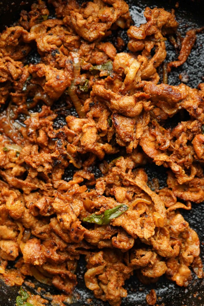 cooked spicy pork bulgogi in cast iron skillet