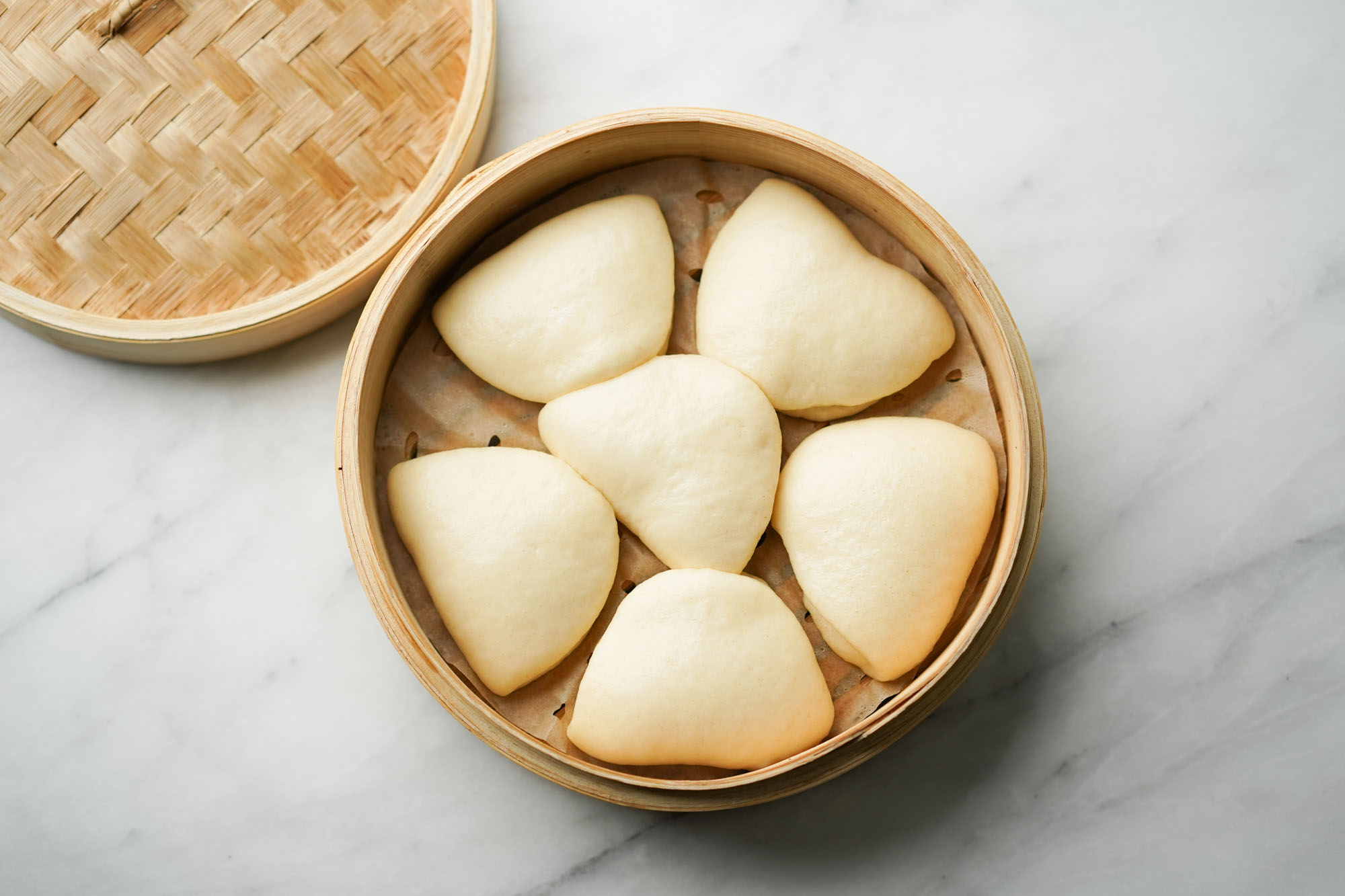 steamed bao buns in a steamer