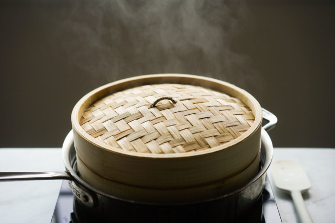 steamy bamboo steamer on the stove