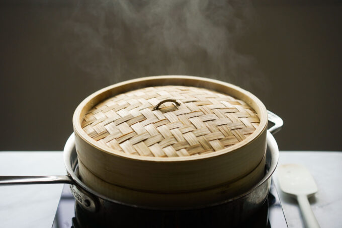 steamy bamboo steamer on the stove